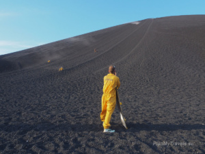 Participant standing at the foot of Cerro Negro Volcano after completing the volcano boarding descent