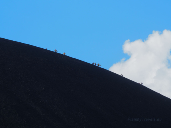 Hikers ascending the steep black volcanic slopes of Cerro Negro, one of Nicaragua's most active volcanoes Hikers ascending the steep black volcanic slopes of Cerro Negro, one of Nicaragua's most active volcanoes